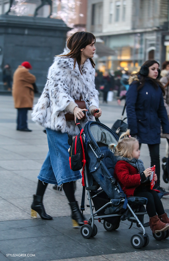 women's winter fashion what to wear street style how to wear white fur coat and denim culottes with ankle boots with block heel, stylish mother with a baby girl