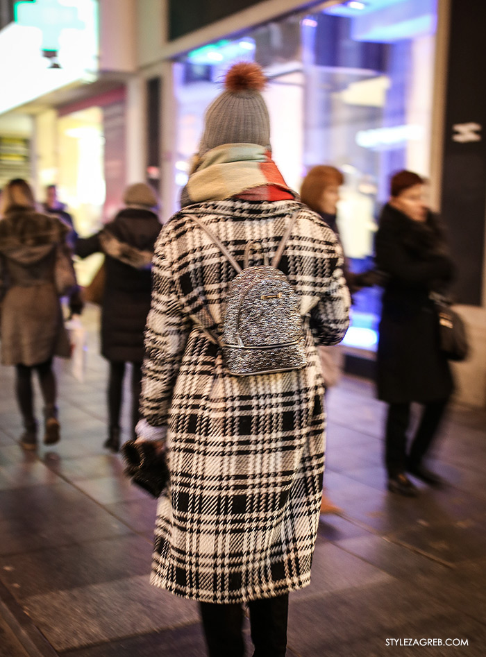 women's winter fashion what to wear street style how to wear plaid oversized coat, beanie and glitter backpack