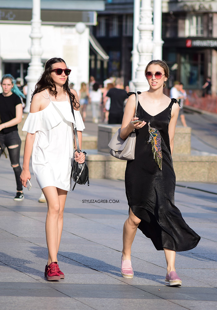 bijela mini haljina otvorenih ramena s volanima, crvene tenisice, crna duga satenska haljina žena sa stilom Zagreb street style ljetna moda srpanj 2017.
